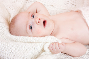 baby  with white shawl