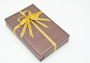 Black gift box with white bar attached gold ribbon