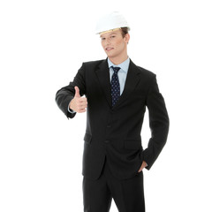 Young businessman in white helmet gesturing ok
