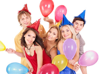 Group of young people in party hat.