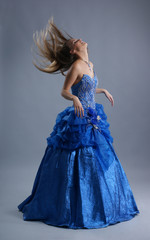 A young and sexy blond bride in a beautiful blue dress