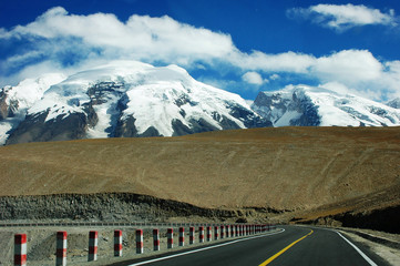 Highway towards snow mountains