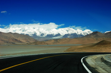 Highway towards snow mountains