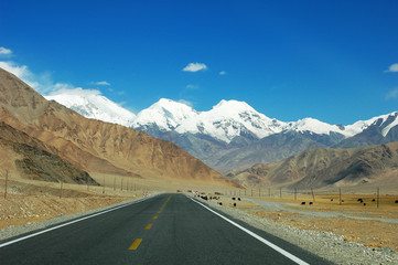 Highway towards snow mountains