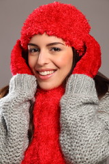 Happy smile by woman in warm festive woolly knits