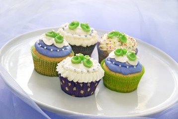 Baby shower cupcakes in purple and green