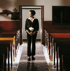 Front View Of A Woman Standing In Church