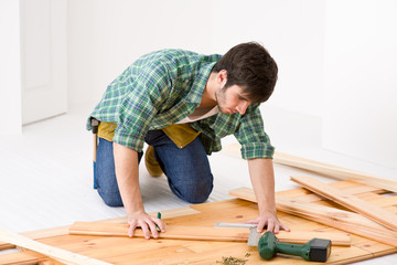 Home improvement - handyman installing wooden floor