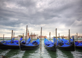 Fototapeta premium Gondolas bobbing in lagoon outside San Marco Piazza Venice Italy