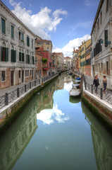 Fototapeta na wymiar Beautiful view along long canal in Venice Italy