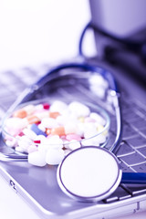 stethoscope and pills