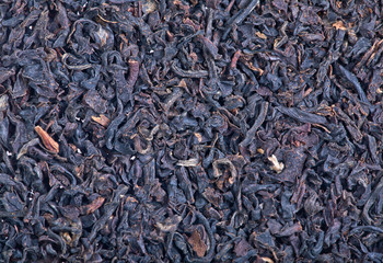 Macro of black tea leaves background