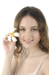 Girl holding white frangipani flower