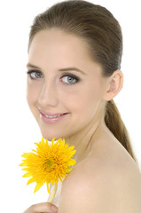 Close up smile holding a yellow sunflower
