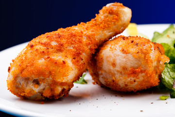 Roasted chicken drumsticks and vegetables