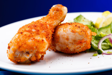 Roasted chicken drumsticks and vegetables