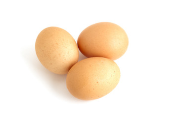 Three eggs on white background