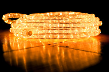 festive abstract of rope lights on a reflective floor