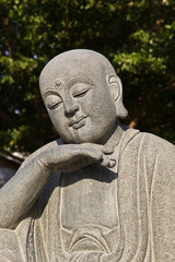 Fototapeta na wymiar Close up shot of the smile buddha face