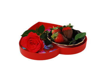 Strawberries in chocolate on red heart shaped tray