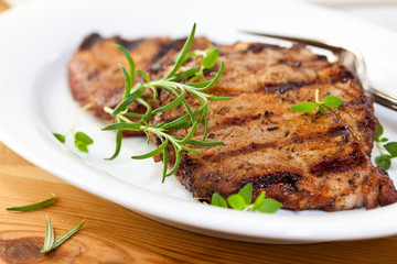 Grilled pork with fresh rosemary and thyme