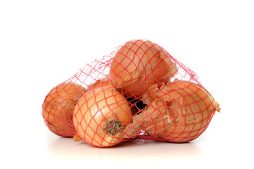 Onions in a net isolated on white
