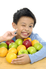 Fototapeta na wymiar Boy with tropical fresh fruit