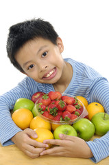 Boy with tropical fresh fruit