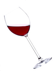 Glass of red wine over white background
