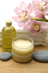 Fototapeta na wymiar spa concept –(orchid and massaging oil and orchid on towel)