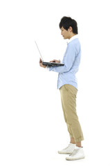 Young man holding laptop on white background