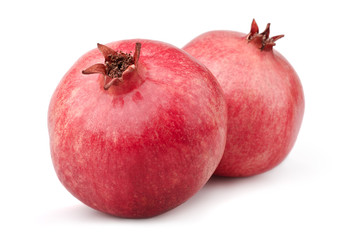 Two pomegranates isolated on a white background