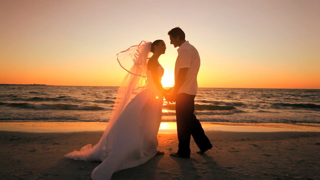 Beach Wedding Kiss at Sunset