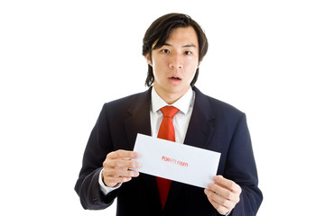 Shocked Asian Businessman Holding Foreclosure Notice Envelope