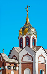 Fototapeta na wymiar Domes of orthodox church against the blue sky