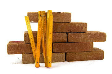Bricks and measuring tool
