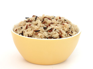 Yellow bowl with cooked rice of various types