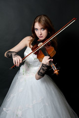 Girl in white dress with violin