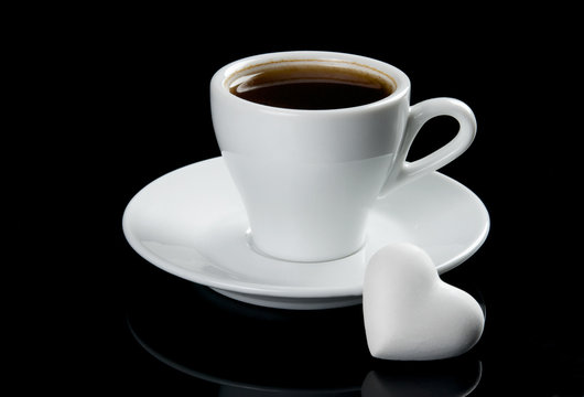 Cup of coffee with heart shape cookie