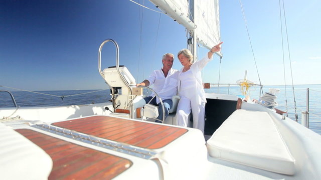 Healthy Seniors Sailing Aboard Their Luxury Yacht