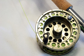 Fly fishing reel - Powered by Adobe