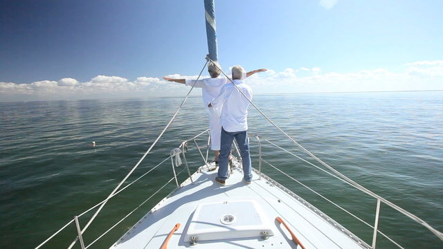 Senior Couple Having Fun Aboard Luxury Yacht