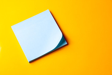blank blue note on orange background