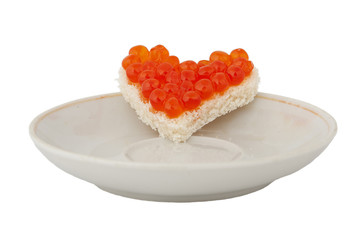 Bread in the form of a heart and red caviar