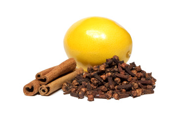 Close-up of cinnamon, clove and lemon