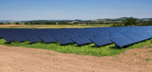 Field with black solar panels