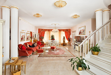 Classic style drawing-room interior in red and golden colors