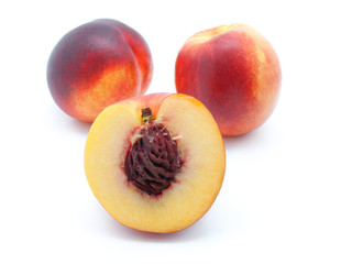 Ripe peach on a white background