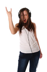 Obraz na płótnie Canvas teenage girl listening music on headphones