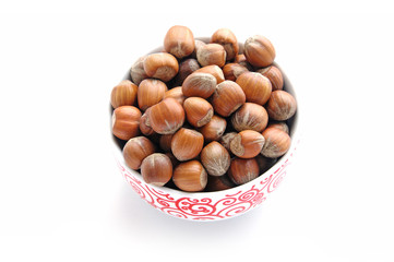 A bowl full of hazelnuts